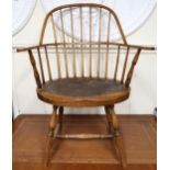 A 19th century elm stick back Windsor armchair with double back over shaped seat on turned