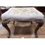 A Victorian oak framed stool with floral tapestry upholstered seat on cabriole supports, 44cm high x