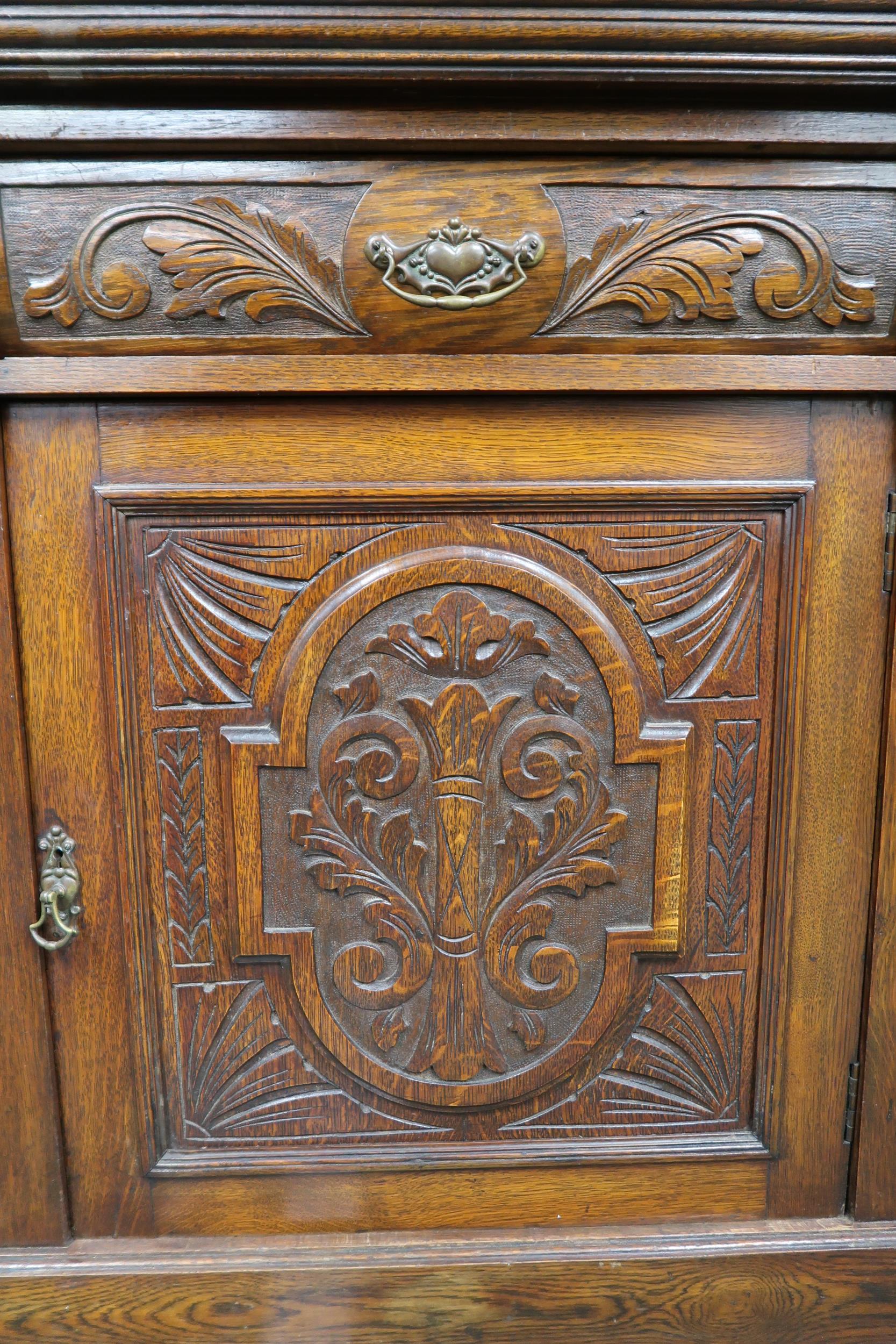 A Victorian oak sideboard with pair of carved drawers over pair of carved doors on plinth base, 99cm - Image 3 of 3