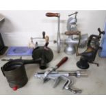 A mixed lot of kitchenalia to include mechanical bottle opener, grinders, marmalade cutter etc