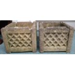 A pair of 20th century reconstituted stone garden planters with gothic grid design to sides, 29cm