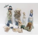 A collection of Lladro and Nao figures including a Geisha, Mother carrying child on back, a Donkey