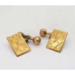 A pair of 9ct gold engraved cufflinks, with monogram and inscribed with the date verso 4/9/1930.