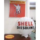 A moulded glass Shell Diesoline pump light globe, Shell advertising sign and a Michelin