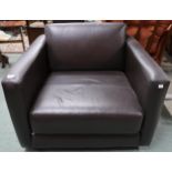 A contemporary dark brown leather upholstered club armchair, 72cm high x 90cm high x 95cm deep