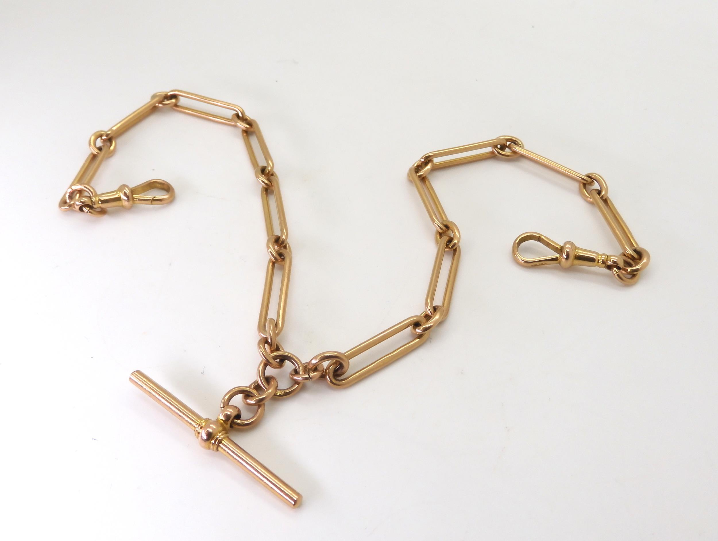 A 9ct gold long and short link double fob chain, hallmarked to every link, the 'T' bar and both