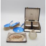 A collection of silver including a three piece blue guilloche enamel dressing set, by Barker