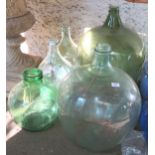 A large glass demijohn, another demijohn, pair of large glass bottles and a large glass jar (5)