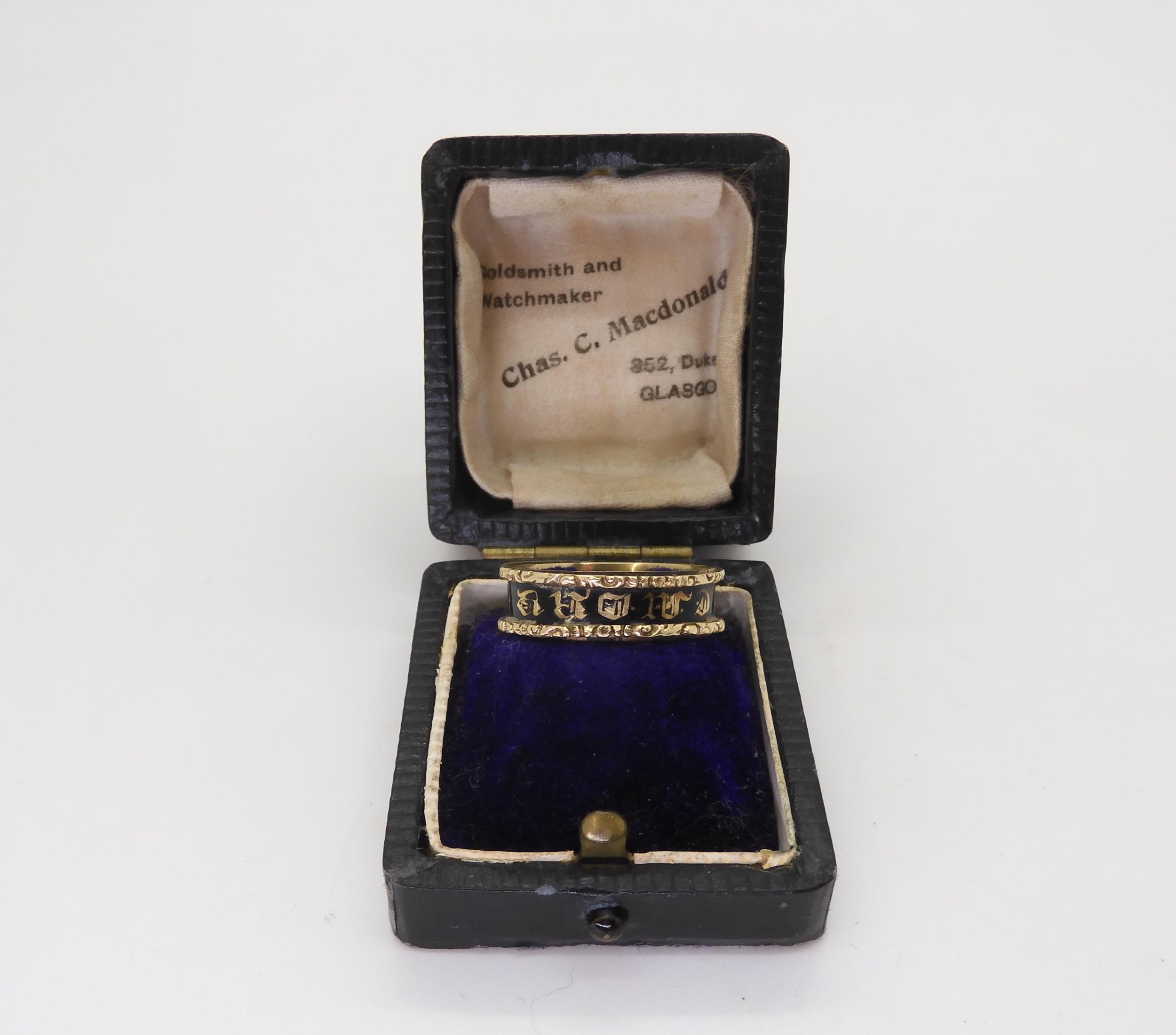 A yellow metal mourning ring, with black enamel, engraved Robert Laing died 1st July 1842, finger