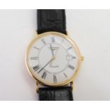An 18k gold Longines Quartz watch, with a black leather strap, with gold plated Longines buckle,