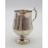 A silver christening mug, by Martin Hall & Co, of swollen baluster form, with a double s scroll