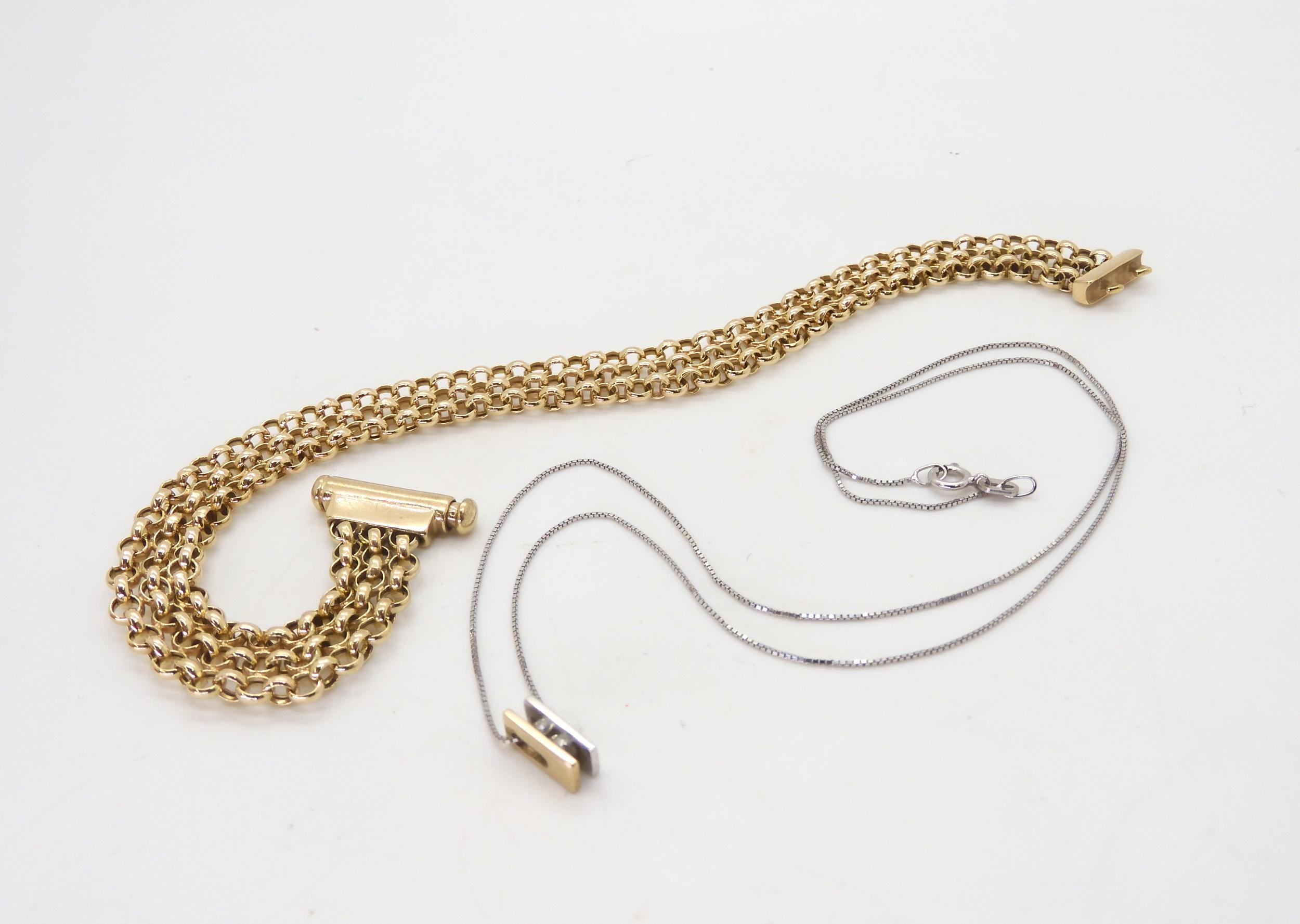 A 9ct yellow and white gold double diamond pendant, pendant 8mm long, chain 40cm, together with a