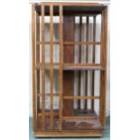 An early 20th century oak two tier revolving bookcase with moulded gallery top, 118cm high x 63cm