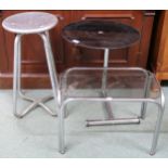 A mid 20th century cast metal stool, circular glass top occasional table and another glass top table