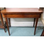 A Victorian mahogany single drawer fold over tea table on square tapering supports, 73cm high x