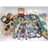 A collection of vintage costume jewellery to include, items by Miracle, farming badges, beads,