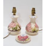 A pair of Moorcroft Magnolia pattern table lamps and a matching dish Condition Report:Available upon