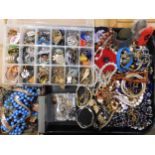 A large collection of vintage costume jewellery to include a frog and budgie brooch, beads and other