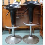 A pair of 20th century revolving bar stools on steel bases (2) Condition Report:Available upon