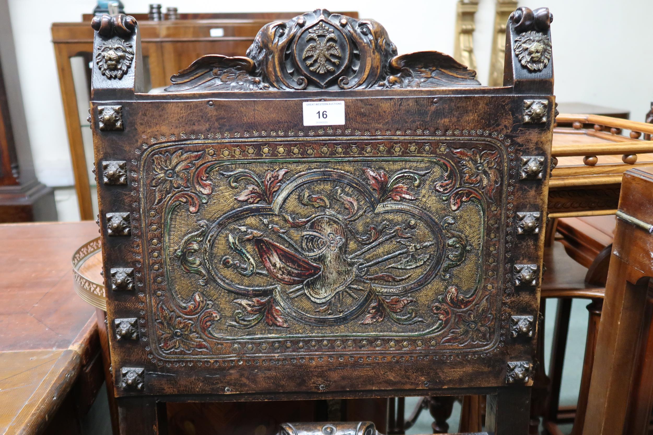 A Victorian stained oak framed Baronial style hall chair with leather back and seat embossed with - Image 2 of 4