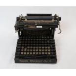 An early-20th century Smith Premier No. 4 dual keyboard typewriter, made in USA, retaining