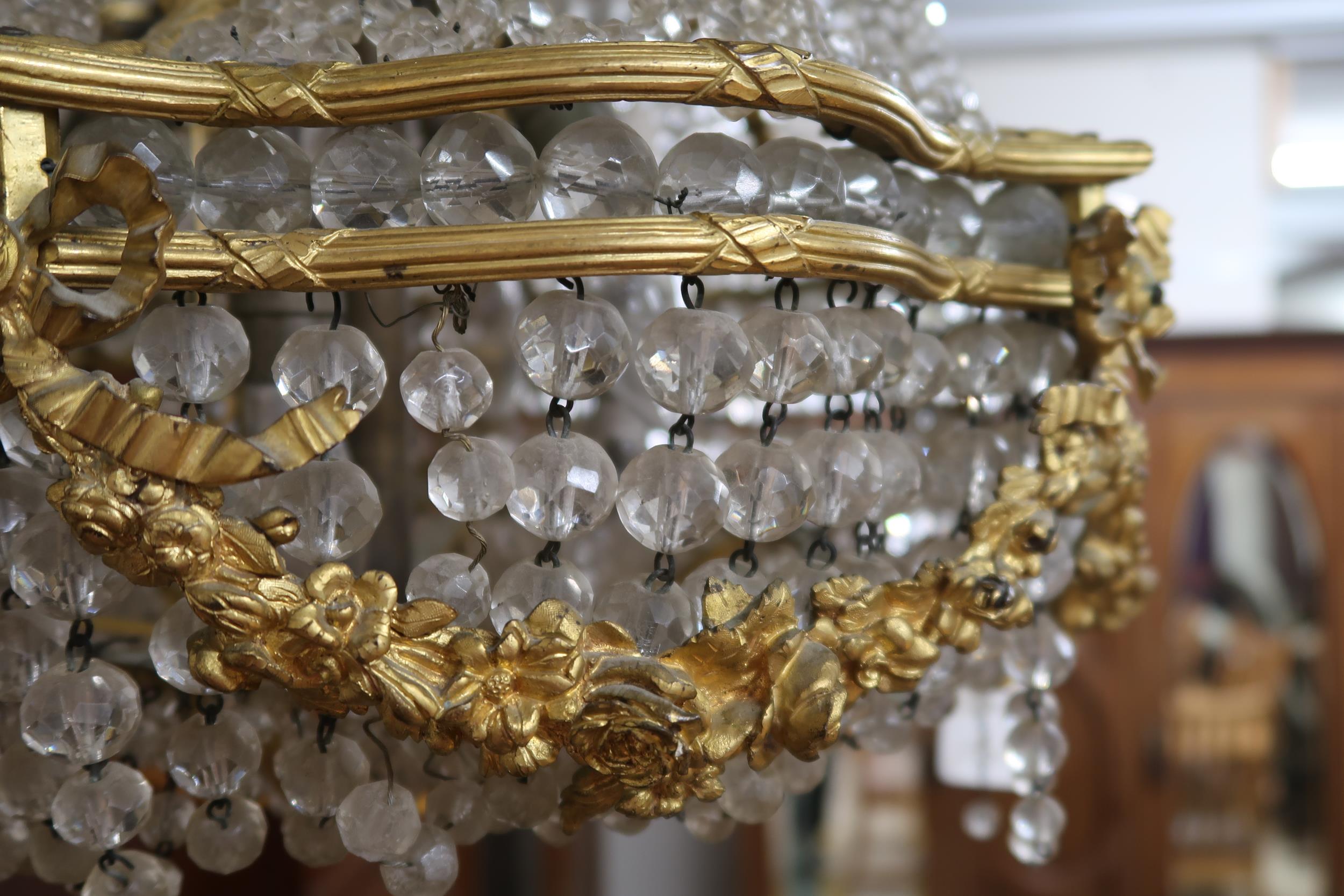 An early 20th century Louis XVI style basket chandelier with cast brass floral swags joined by - Image 4 of 5