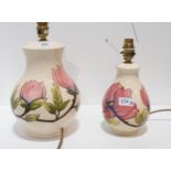 A large Moorcroft Magnolia pattern lamp and another smaller Condition Report:Available upon request