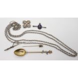 A white metal long guard chain, with attached whip pendant with hoof terminal, a silver gilt spoon
