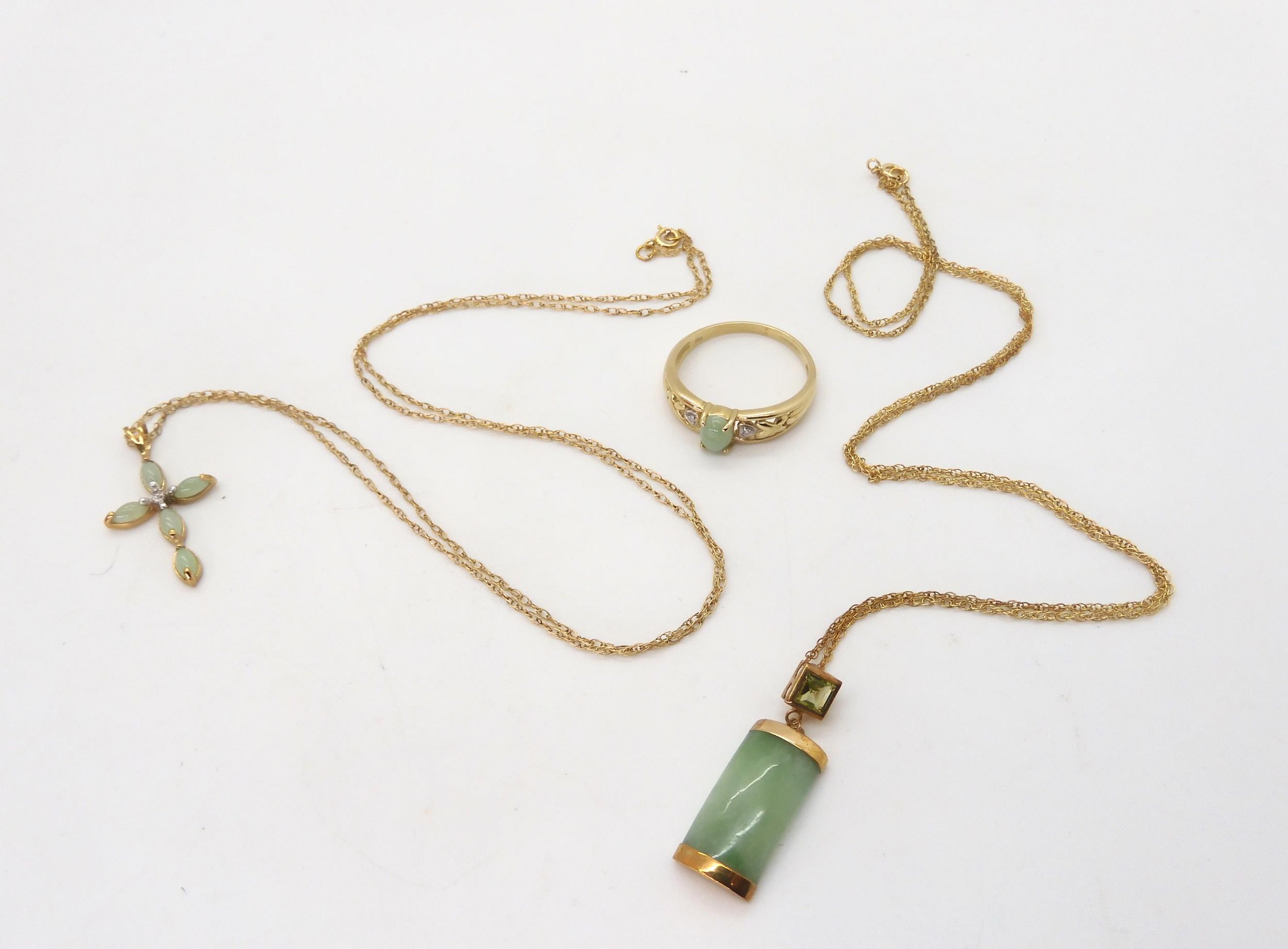 A 9ct gold green hardstone cross set with a diamond accent, on a 50cm rope chain, a further 9ct