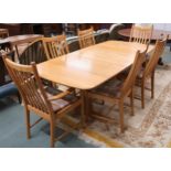 A contemporary Ercol elm and beech dining suite comprising extending dining table, 74cm high x 151cm