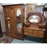 A late Victorian mahogany and satinwood inlaid two piece bedroom suite comprising mirror doored