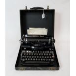 A Remington Rand Model 1 portable typewriter, vintage Electro-lux vacuum cleaner in pine case and
