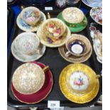 An assortment of cabinet cups and saucers including Aynsley fruit decorated by D Jones, flower