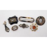 A Scottish banded agate brooch of baton form with white metal finials, a Ward Brothers golden