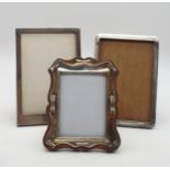 A collection of silver mounted photo frames, including a scrolling example, by Samuel M Levi