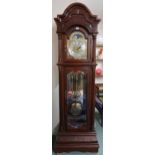 A 20th century mahogany cased longcase clock with arched brass and silvered dial bearing Arabic