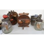 A mixed lot to include three assorted hand cranked butter churns, hand cranked ice cream machine and