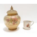 A Royal Worcester jar and cover decorated with flowers together with a Nautilus Glasgow Exhibition