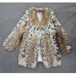 A Lynx fur coat retailed by Harrods, another fur coat and assorted fur stoles etc Condition Report: