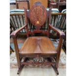 A 20th century mahogany and satinwood inlaid rocking chair Condition Report:Available upon request