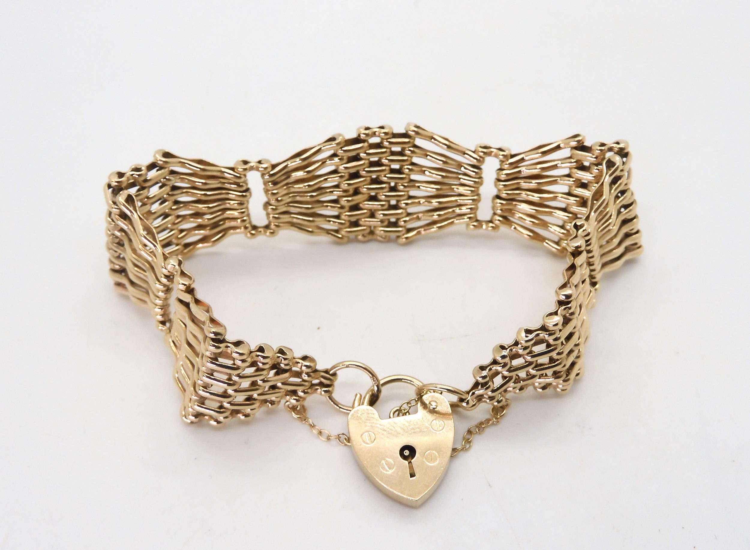 A 9ct gold wide gate bracelet with heart shaped clasp, length approx 18cm, width2cm, weight 29. - Image 2 of 3