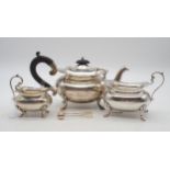 A martched George V three piece silver tea service, the teapot and ugar bowl by Walker & Hall,