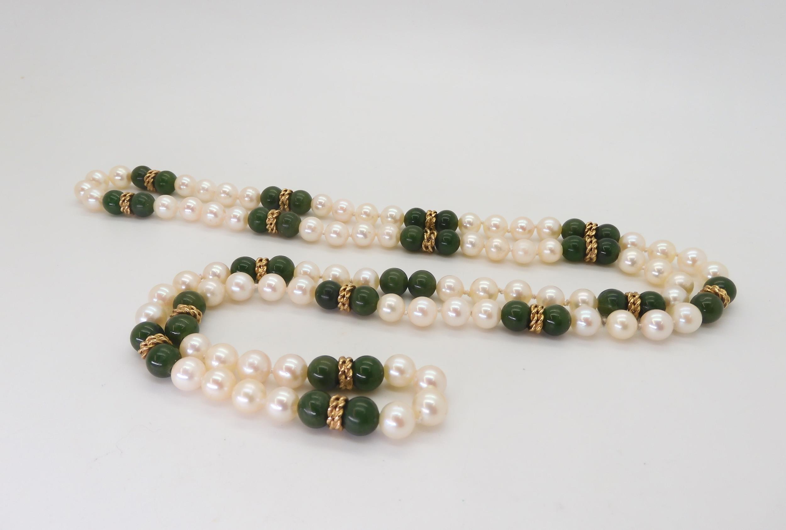 An opera length of good quality pearls, Chinese green hardstone and gold beads, length 88cm