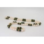 An opera length of good quality pearls, Chinese green hardstone and gold beads, length 88cm