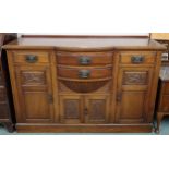 A late Victorian mahogany art nouveau style sideboard with two central bow front drawers over pair