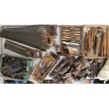 A large mixed lot of assorted carpentry tools to include chisels, wood planes, moulding planes etc