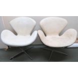 A contemporary Arne Jacobsen for Fritz Hansen swivel chair and another swivel chair in the manner of