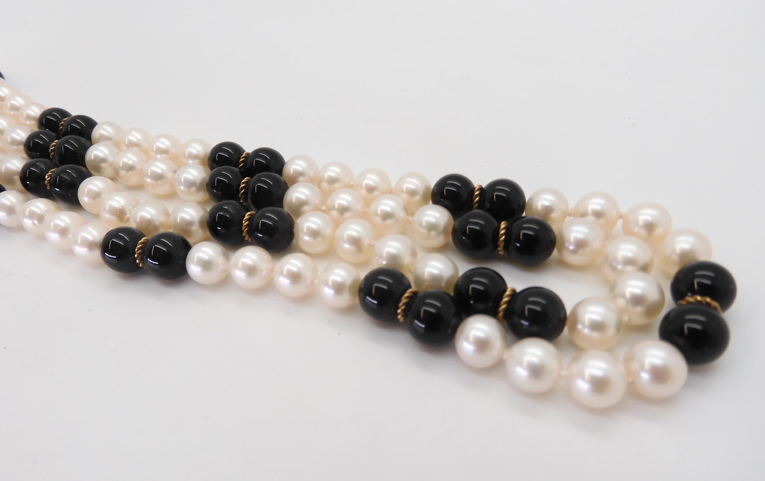 An opera length of good quality pearls, onyx and gold beads, length 88cm Condition Report: - Image 2 of 3