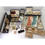 A Kramer flower brooch, and a collection of vintage costume jewellery to include faux pearls