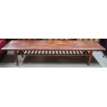 A large mid 20th century Nils Jonsson for Troeds teak coffee table on turned tapering supports